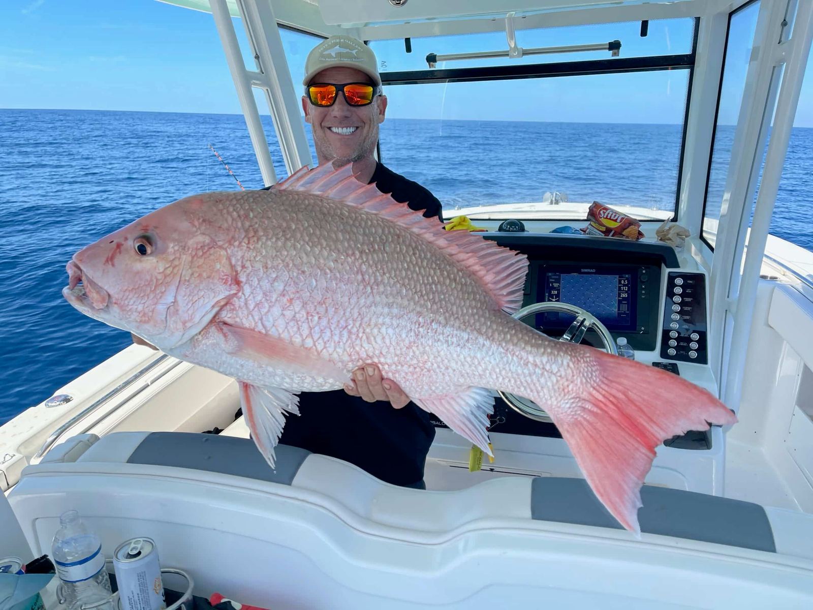 Angler with a big red snapper on a Sarasota charter boat