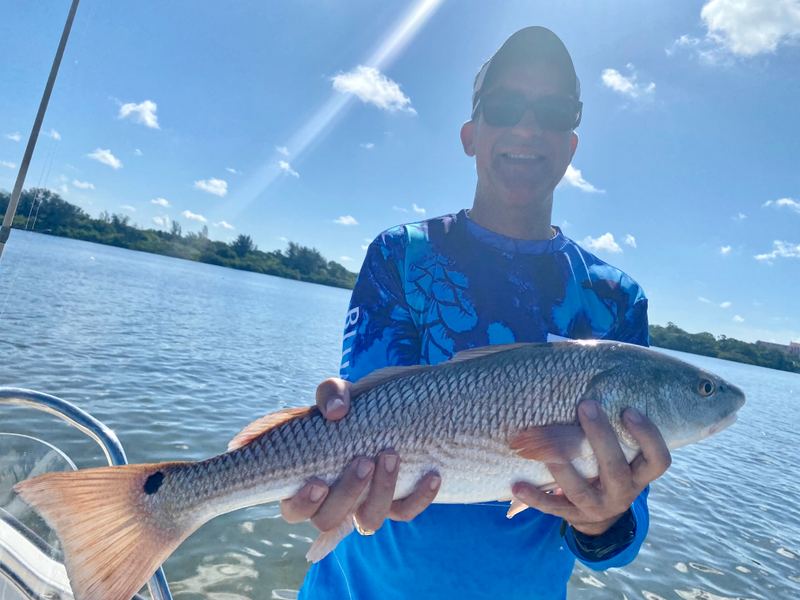 A slot redfish, held for a photo before release.