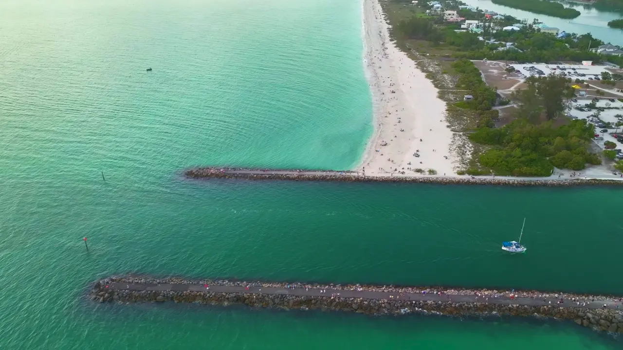 Sand pockets against the Venice jetty rocks hold the county's best shore flounder.
